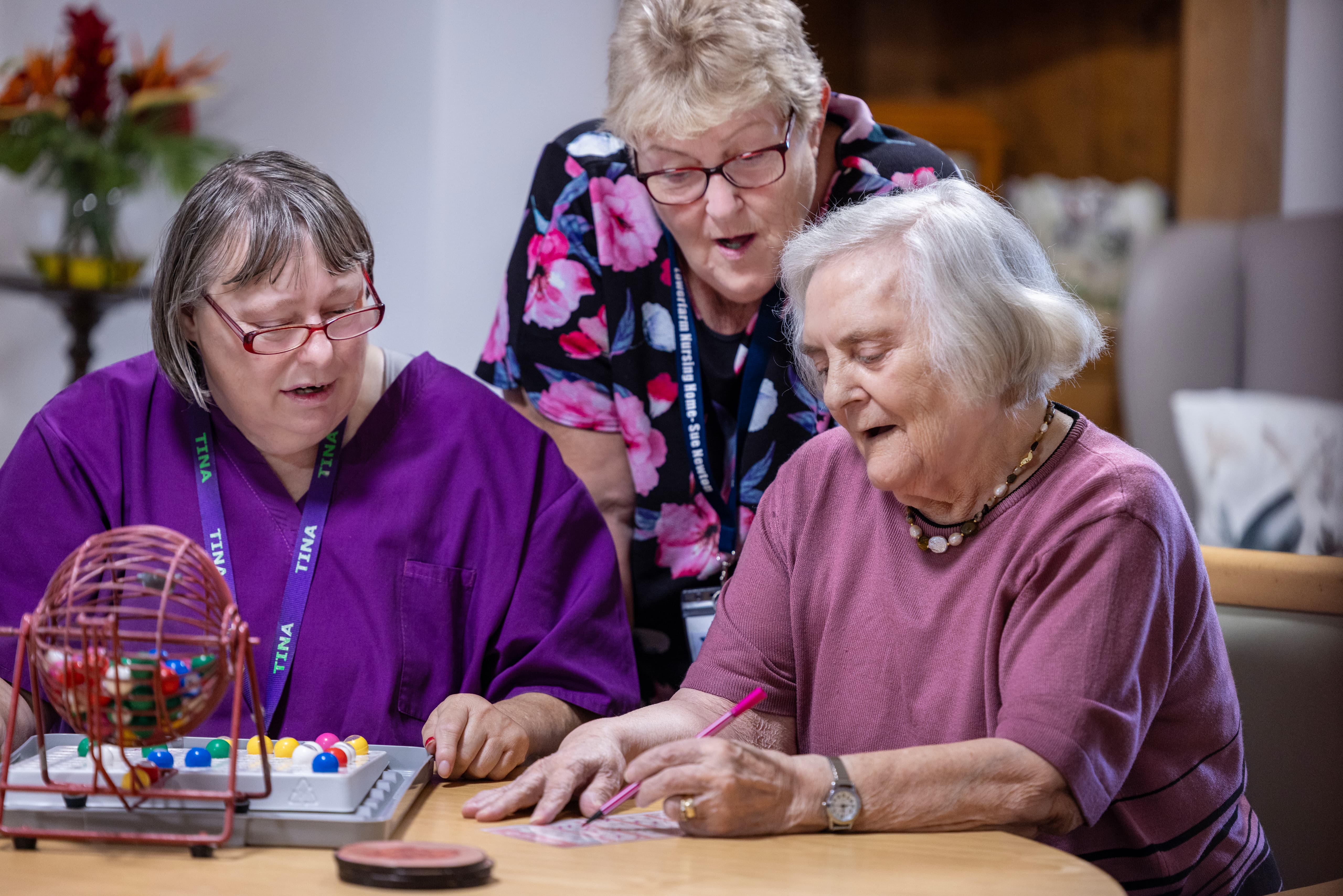 Staff helping residents with group activities