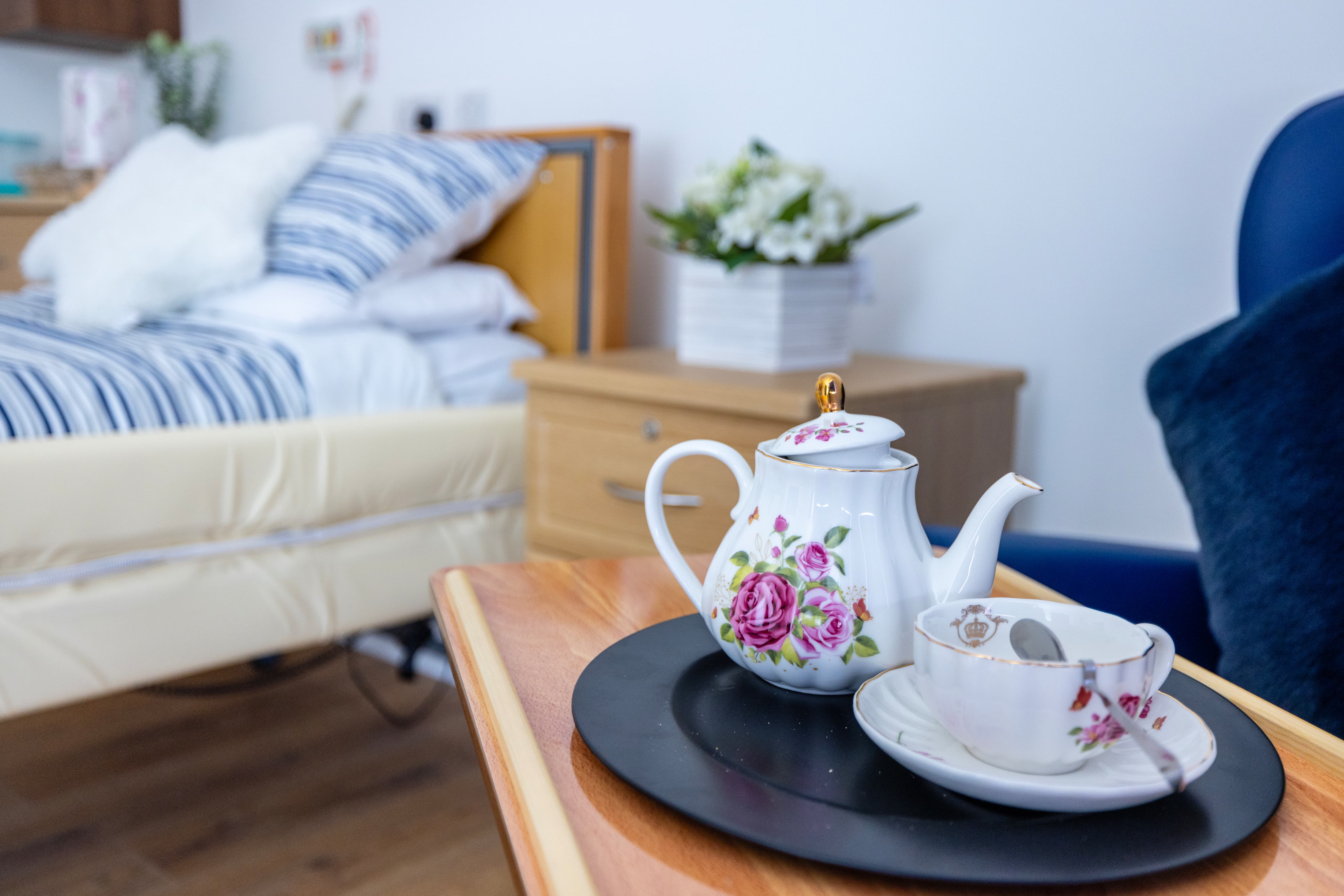 Elegant tea service with fine china in resident room